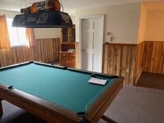 recreation room with wood walls, pool table, carpet flooring, and wainscoting