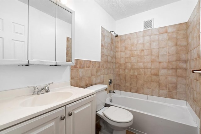 6 Arizona Ter Unit 2, Arlington, MA 02474 - bathroom with shower / tub combination, vanity, a textured ceiling, and tile walls