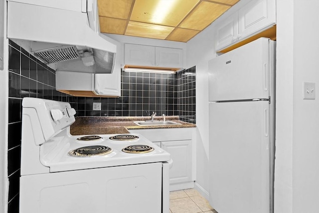 6 Arizona Ter Unit 2, Arlington, MA 02474 - kitchen featuring white appliances, premium range hood, dark countertops, white cabinetry, and light tile patterned flooring
