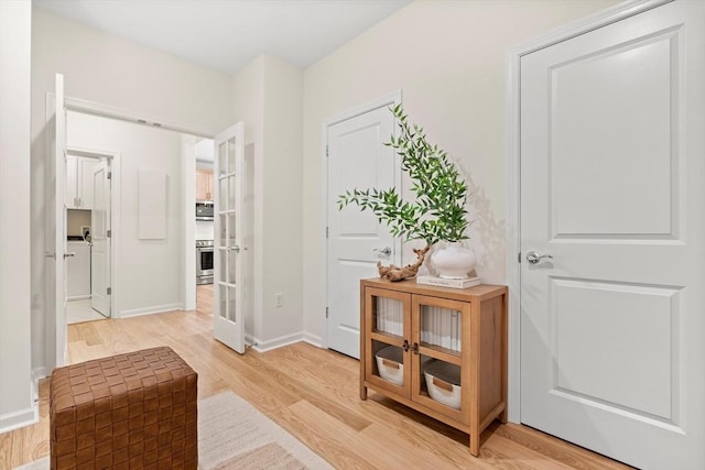 entryway featuring french doors and light hardwood / wood-style floors