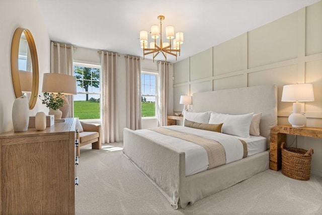 carpeted bedroom featuring a notable chandelier