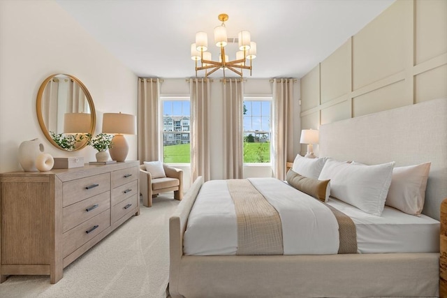 bedroom with light colored carpet and an inviting chandelier