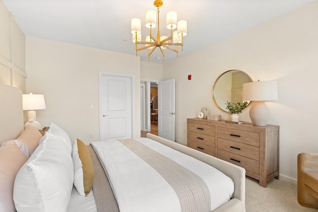 carpeted bedroom with a notable chandelier