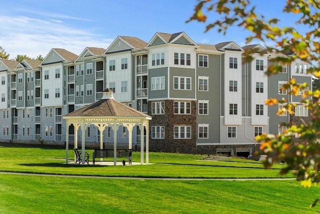 view of property's community featuring a gazebo and a lawn