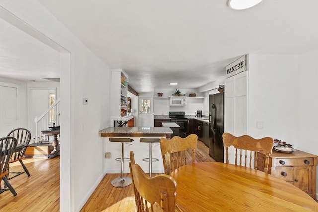 dining room with light wood-type flooring