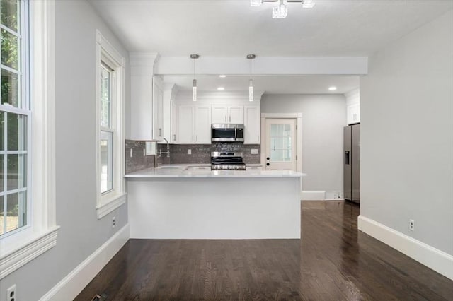 68 Putnam St, Weymouth, MA 02189 - kitchen with stainless steel appliances, baseboards, backsplash, dark wood-type flooring, and recessed lighting