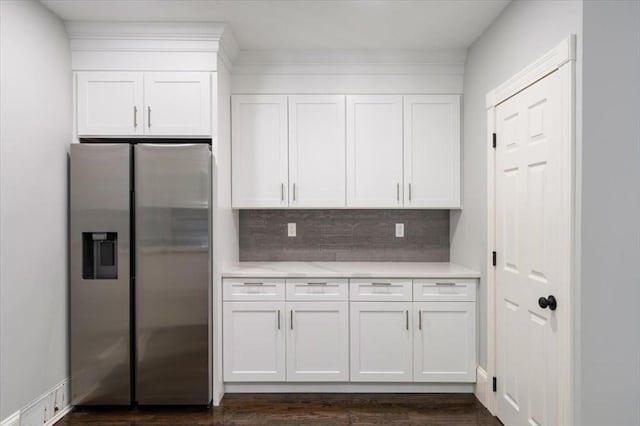 68 Putnam St, Weymouth, MA 02189 - kitchen featuring stainless steel refrigerator with ice dispenser, light countertops, white cabinets, and tasteful backsplash