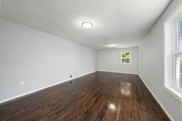 68 Putnam St, Weymouth, MA 02189 - empty room featuring dark wood-type flooring and baseboards
