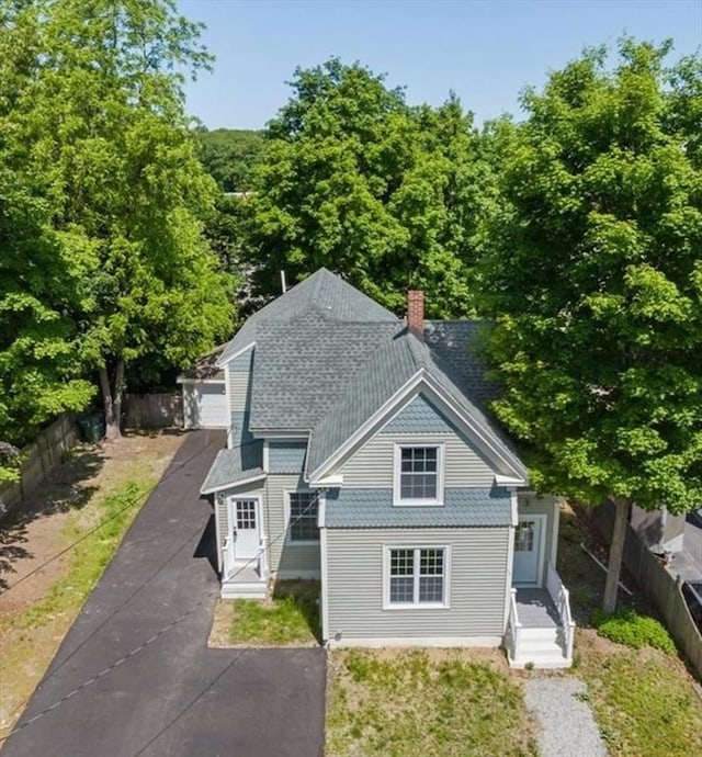 68 Putnam St, Weymouth, MA 02189 - back of property with a chimney and a shingled roof