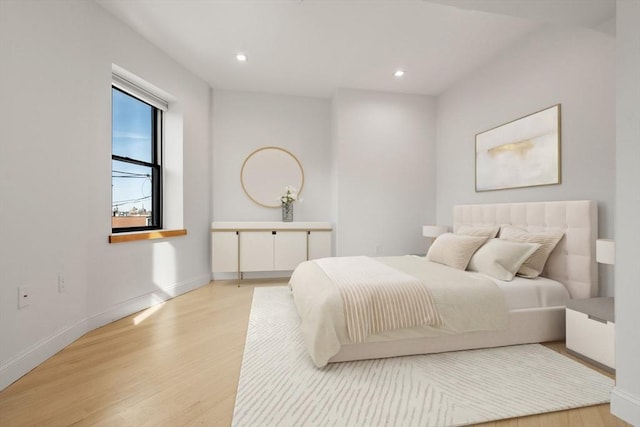 bedroom with recessed lighting, baseboards, and light wood finished floors