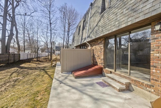 exterior space featuring entry steps and fence