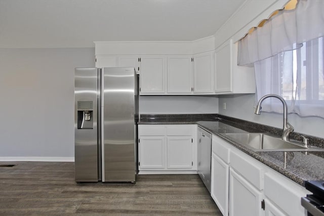 kitchen featuring a sink, white cabinets, dark wood-style flooring, and stainless steel appliances