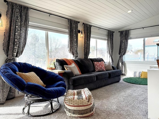 living area with vaulted ceiling, wood ceiling, and carpet