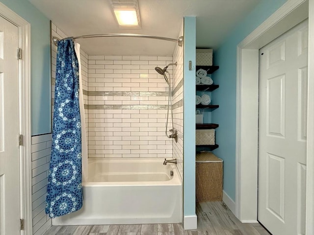 full bath featuring shower / bath combination with curtain and wood finished floors