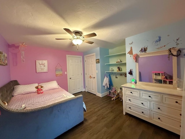 bedroom with ceiling fan, baseboards, a textured ceiling, and dark wood-style floors