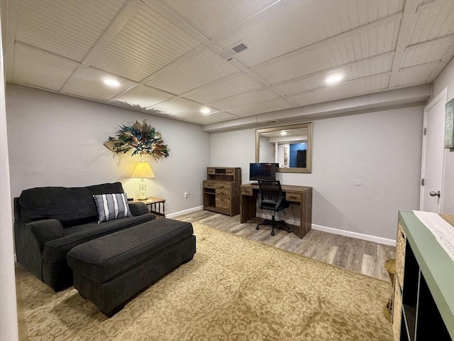 office featuring visible vents, baseboards, and wood finished floors