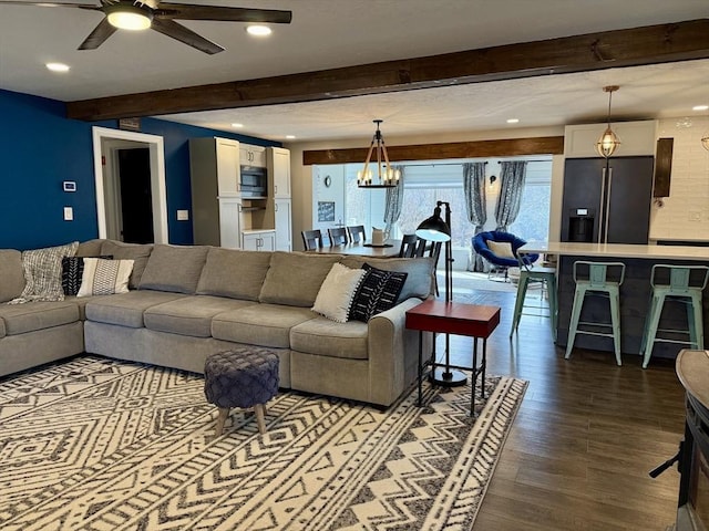 living room with recessed lighting, beamed ceiling, wood finished floors, and ceiling fan with notable chandelier