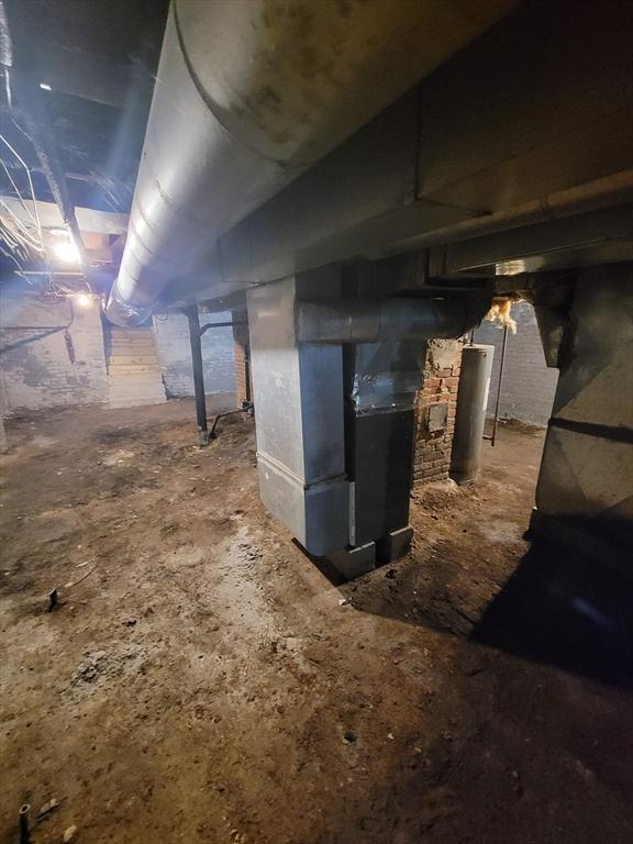 30 Forest Park Ave, Springfield, MA 01108 - unfinished basement featuring heating unit and gas water heater