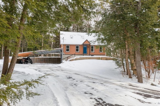 view of front of property featuring a carport