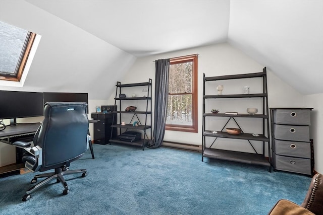 office area featuring carpet flooring, vaulted ceiling with skylight, and a baseboard heating unit