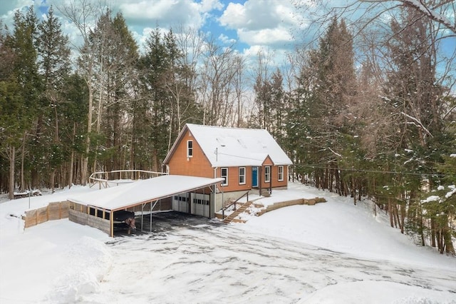 view of snow covered house