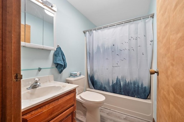 full bathroom with vanity, hardwood / wood-style flooring, shower / tub combo, and toilet