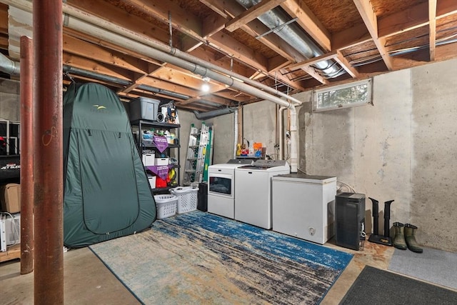 basement with separate washer and dryer and refrigerator