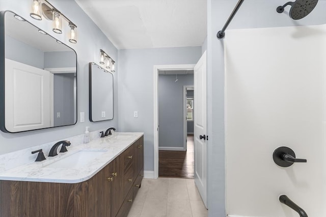 26 W Park St, Franklin, MA 02038 - bathroom with double vanity, a shower, and tile patterned floors