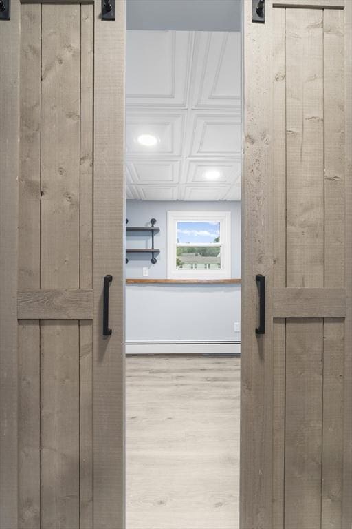 26 W Park St, Franklin, MA 02038 - bathroom with wood finished floors and a baseboard heating unit