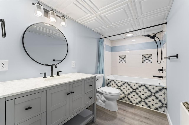 26 W Park St, Franklin, MA 02038 - full bath featuring vanity, tiled shower / bath combo, and wood finished floors