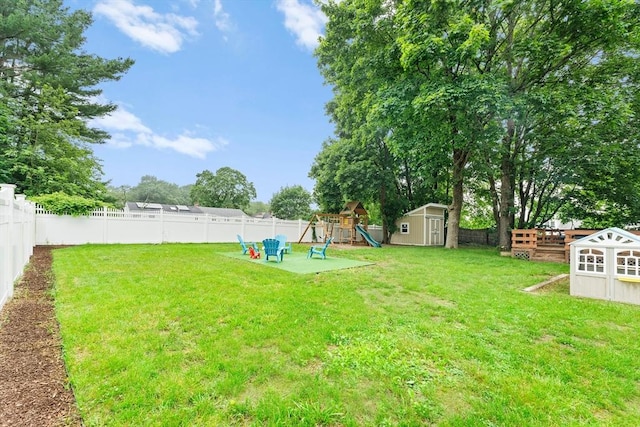 26 W Park St, Franklin, MA 02038 - fenced backyard featuring a storage shed and a playground
