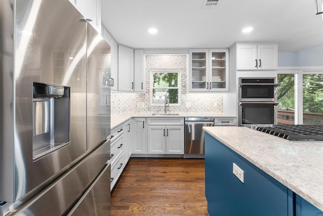 26 W Park St, Franklin, MA 02038 - kitchen with stainless steel appliances, glass insert cabinets, white cabinetry, and recessed lighting