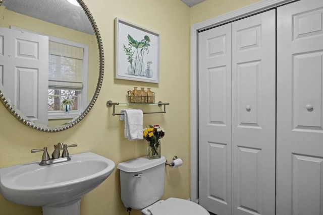 2240 Turnpike St, North Andover, MA 01845 - half bathroom featuring a sink, a closet, and toilet