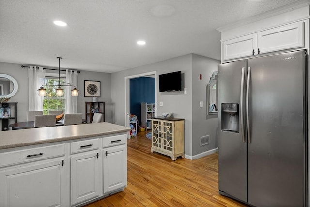 2240 Turnpike St, North Andover, MA 01845 - kitchen featuring stainless steel fridge with ice dispenser, light wood-type flooring, white cabinetry, recessed lighting, and baseboards