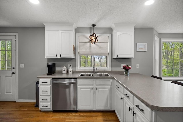2240 Turnpike St, North Andover, MA 01845 - kitchen with stainless steel dishwasher, a sink, a peninsula, healthy amount of natural light, and recessed lighting