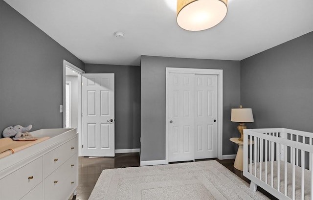 2240 Turnpike St, North Andover, MA 01845 - bedroom with a closet, baseboards, and dark wood finished floors