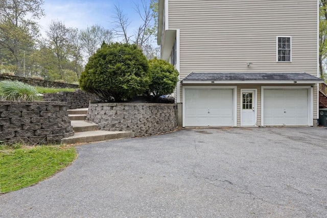 2240 Turnpike St, North Andover, MA 01845 - view of side of home with driveway and an attached garage