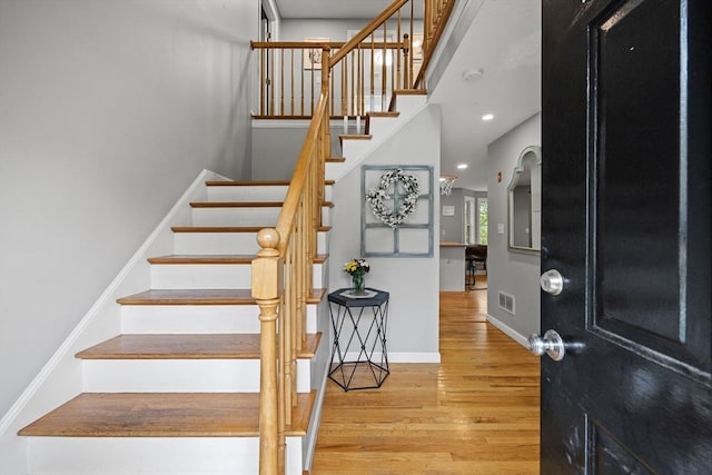 2240 Turnpike St, North Andover, MA 01845 - entryway with wood finished floors, stairs, baseboards, and recessed lighting
