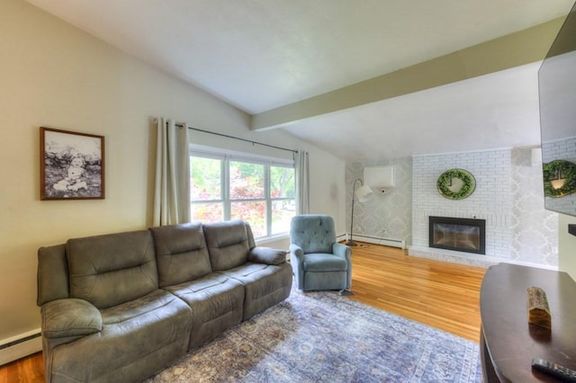 36 Winthrop St, West Boylston, MA 01583 - living room with a baseboard radiator, wood finished floors, and a brick fireplace