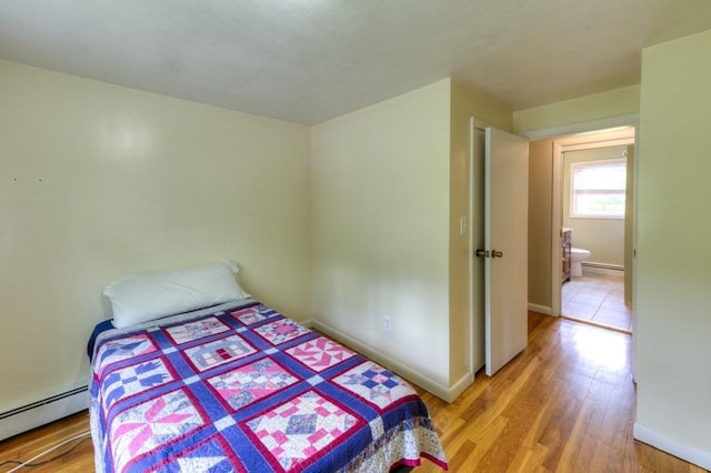 36 Winthrop St, West Boylston, MA 01583 - bedroom featuring baseboard heating, light wood finished floors, and baseboards