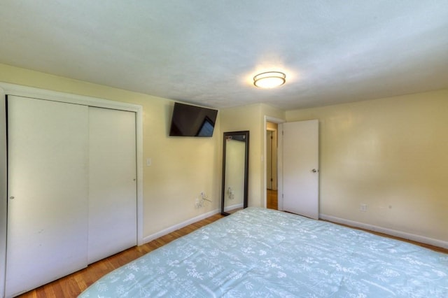 36 Winthrop St, West Boylston, MA 01583 - unfurnished bedroom featuring baseboards, wood finished floors, and a closet