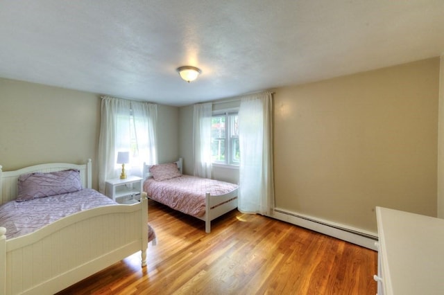 36 Winthrop St, West Boylston, MA 01583 - bedroom featuring baseboard heating and light wood-type flooring