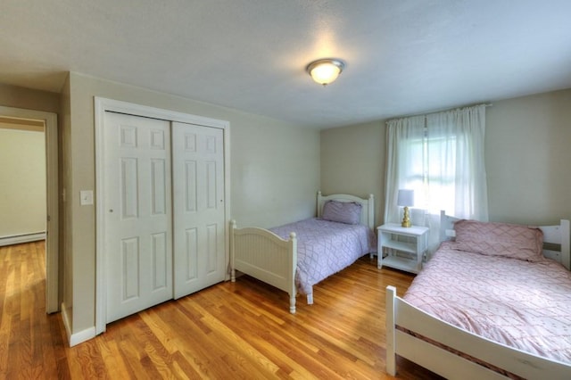 36 Winthrop St, West Boylston, MA 01583 - bedroom featuring light wood-style flooring, a closet, and baseboard heating