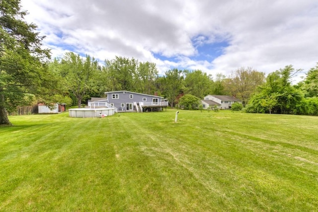 36 Winthrop St, West Boylston, MA 01583 - view of green lawn with a deck and view of wooded area