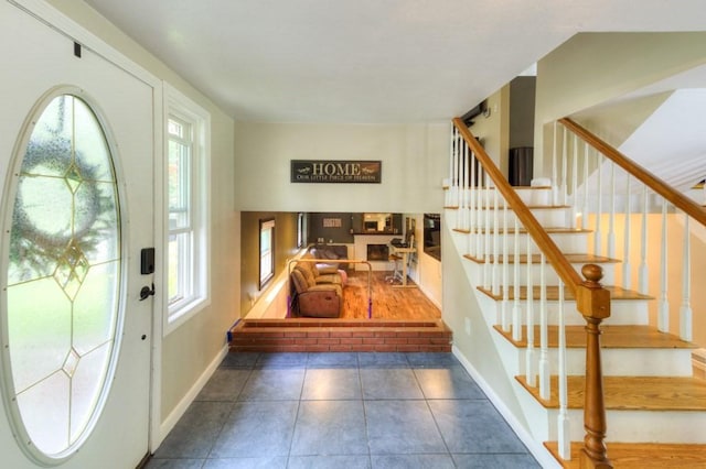 36 Winthrop St, West Boylston, MA 01583 - entryway featuring healthy amount of natural light, tile patterned flooring, stairway, and baseboards
