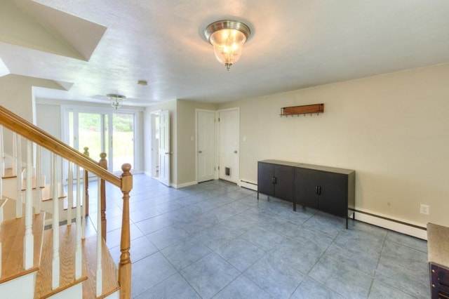 36 Winthrop St, West Boylston, MA 01583 - foyer entrance featuring baseboard heating, stairs, a baseboard heating unit, baseboards, and tile patterned floors