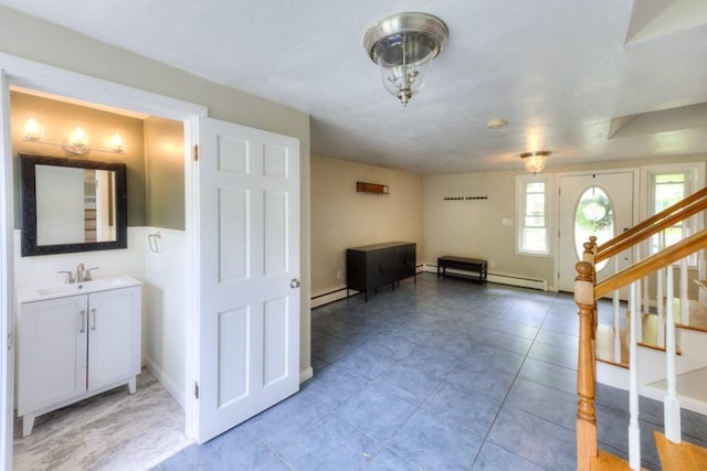 36 Winthrop St, West Boylston, MA 01583 - foyer featuring a baseboard heating unit, stairway, and light tile patterned flooring