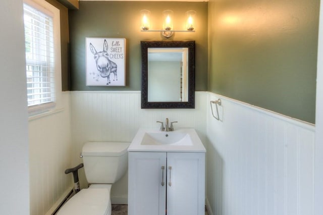 36 Winthrop St, West Boylston, MA 01583 - bathroom with wainscoting, vanity, toilet, and a baseboard radiator