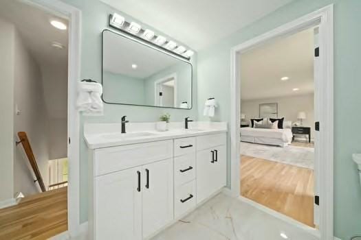 368 King St, Hanover, MA 02339 - ensuite bathroom with double vanity, wood finished floors, and recessed lighting