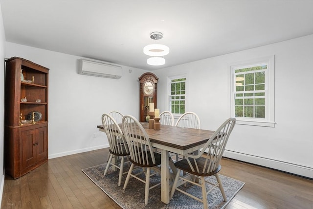 dining room featuring an AC wall unit, dark wood-style flooring, and baseboards